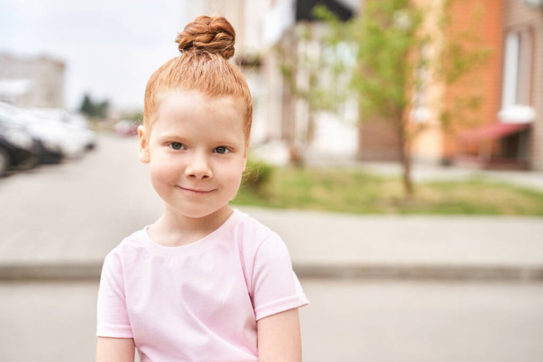 Little girl outdoor portrait. Red hair. Happy baby face. Female person - Φωτογραφία, εικόνα
