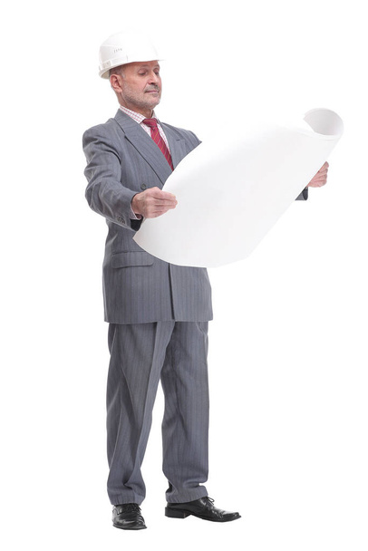 Serious businessman in white hardhat blueprint and looking at camera - Foto, Imagem