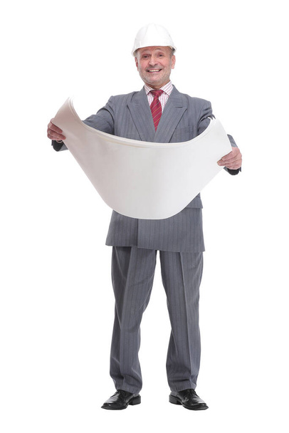 Smiling businessman in white hardhat blueprint and looking at camera - Foto, Imagem