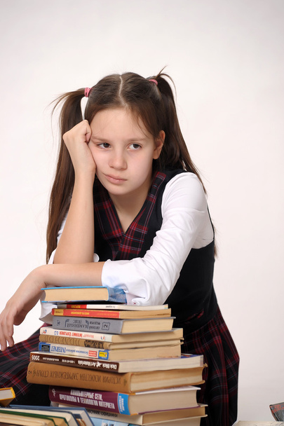 Girl with a big stack of books - Foto, Bild