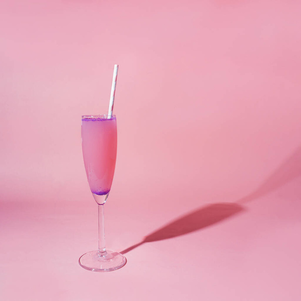 Champagne glass with pink drink on the pink background. Valentines Day creative minimal idea - Zdjęcie, obraz