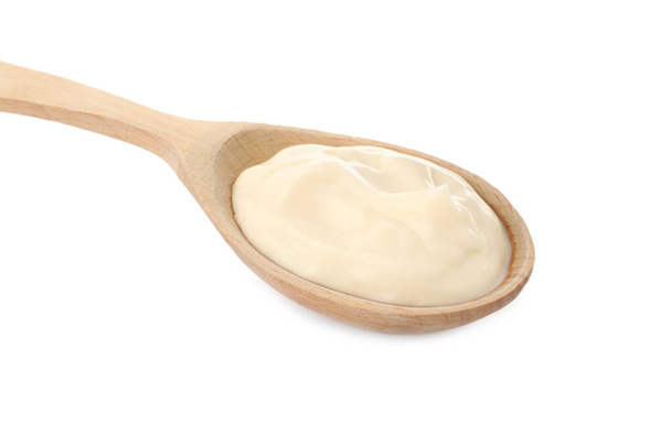 Wooden spoon with mayonnaise isolated on white - Fotoğraf, Görsel