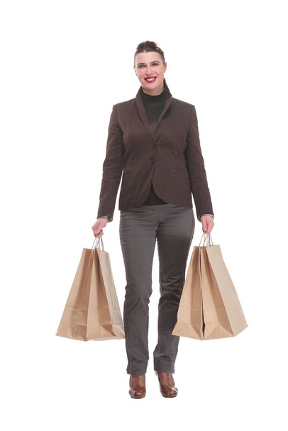 Happy young woman with shopping bags on white background - Photo, Image