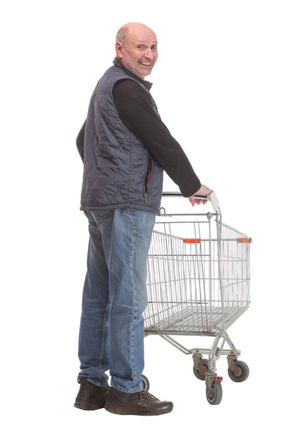 A full length portrait of a man pushing an empty shopping cart and sign ok - Foto, immagini