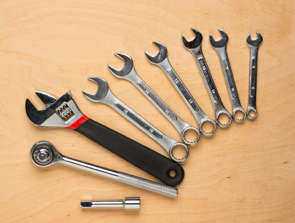 Set of tools on a wood panel - Фото, изображение