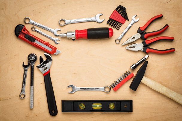 Set of tools on a wood panel - Foto, Bild