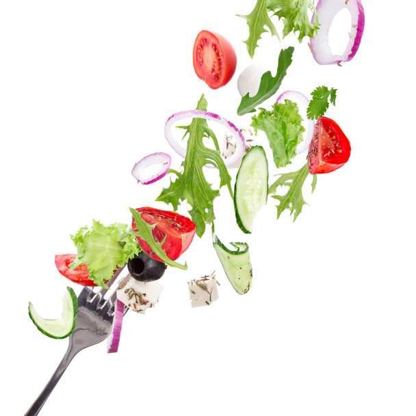 Fresh salad with flying vegetables ingredients - Photo, Image