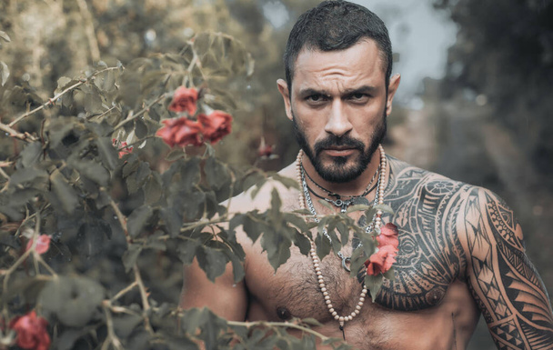 Confident and handsome Brutal man. Stylish sexy man looking away. Portrait of handsome male model. Brutal handsome man with tattooed body. Men fashion Brutal models. - Photo, image