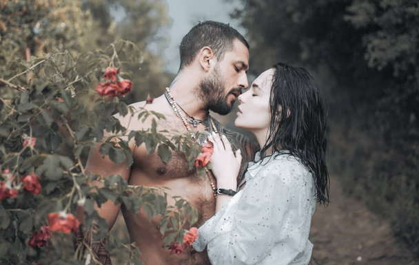 Sensual couple kiss. First love. Hugs together and sensual touch. Intimate relationship and sexual relations. Passionate lover caressing arousing beautiful woman. Woman with muscular latin lover. - Фото, зображення