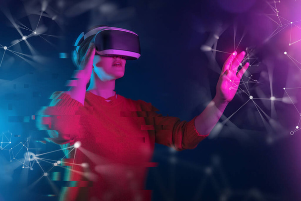 Metaverse technology concept. Woman with VR virtual reality goggles. Futuristic lifestyle. - Zdjęcie, obraz