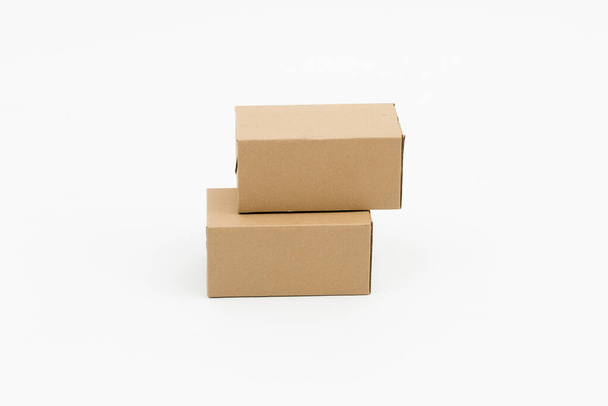 Two closed cardboard boxes on a white background - Fotografie, Obrázek