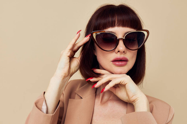portrait of a woman Charm red nails model luxury sunglasses isolated background - 写真・画像