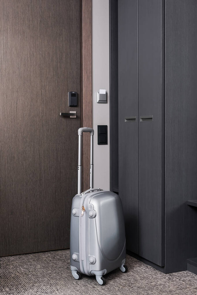 grey luggage in modern hotel room  - Φωτογραφία, εικόνα