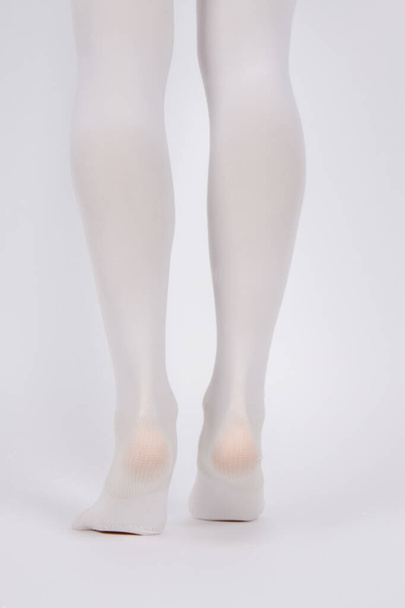 Anti-embolic Compression Hosiery for surgery isolated on white. Medical white stockings, tights for varicose veins and venouse therapy. Thrombo embolic deterrent hose or anti-embolism stockings - Fotó, kép