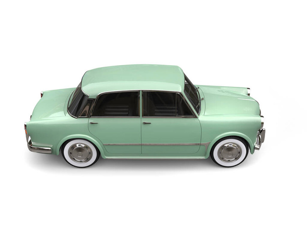 Restored vintage compact car with  pastel green color paint - back side view - Zdjęcie, obraz