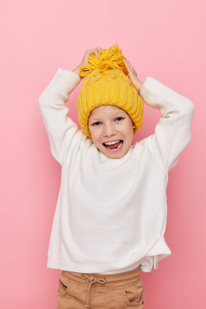 little girl fun in a yellow hat fun isolated background - Фото, изображение