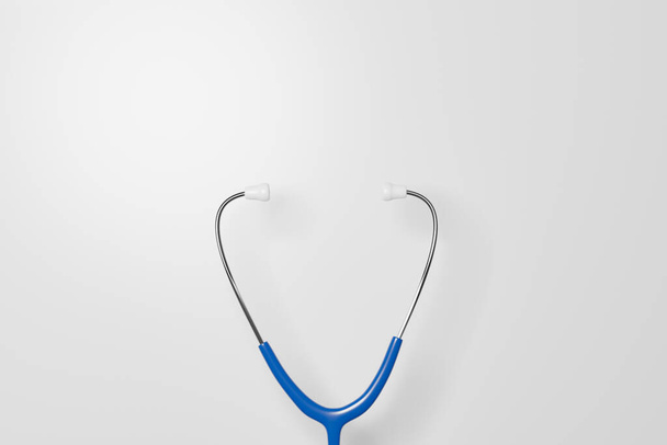 Синий стетоскоп на белом фоне. Медицинское обслуживание, страхование здоровья. Трехмерная иллюстрация - Фото, изображение