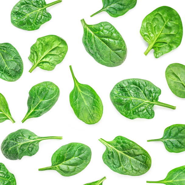 Spinach Pattern. Fresh Spinach baby leaves isolated on white background. Top view. Flat lay - 写真・画像