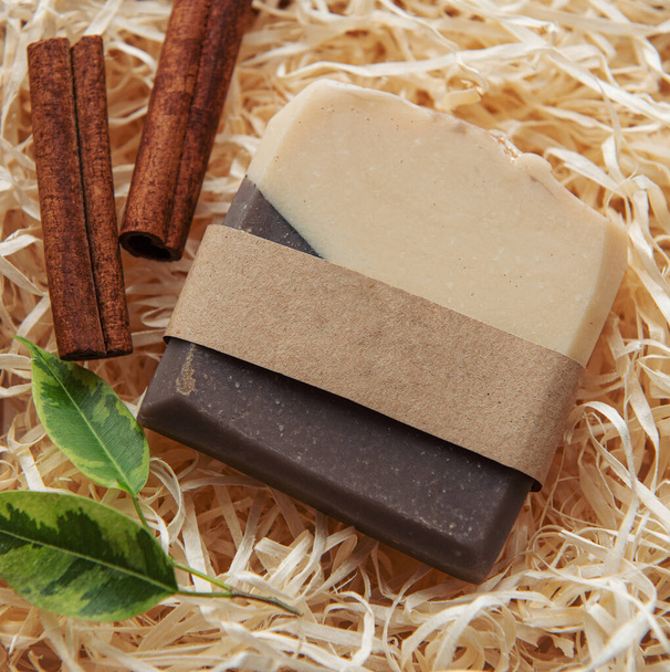 Natural handmade soap with cinnamon on straw background - Φωτογραφία, εικόνα