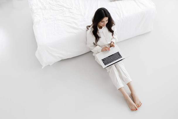 young cozy woman working in laptop at home up - Photo, Image