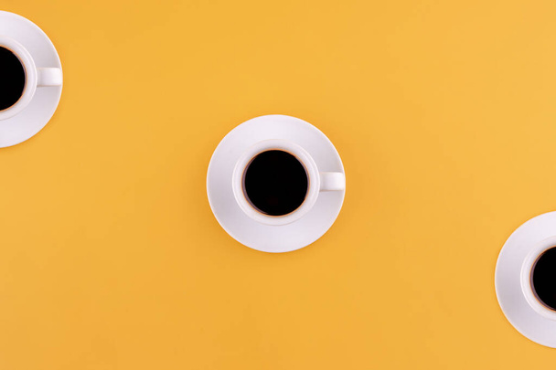 cup of americano coffee on a yellow background. Space for text. - Photo, Image