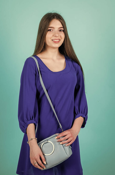 she likes this bag. teenager girl with female bag. childhood happiness. fashion and beauty. - Φωτογραφία, εικόνα