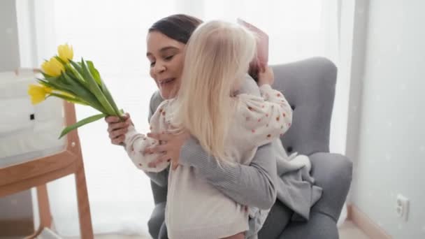 Elementary age girl about to hand in flowers to her mother. Shot with RED helium camera in 8K. - Video