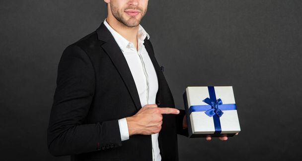 cropped businessman hold gift box for mens or womens day - Φωτογραφία, εικόνα