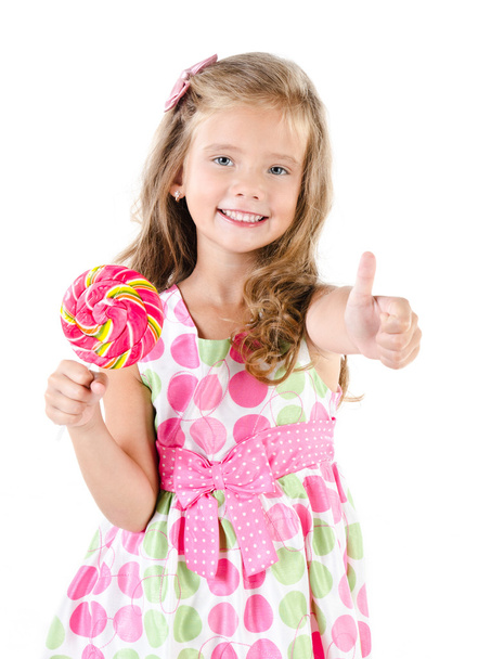Happy little girl with lollipop and figer up - Φωτογραφία, εικόνα