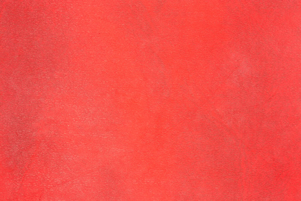 Fragment of the hard cover of book made with red material remotely imitating leather close-up, texture, background - Zdjęcie, obraz