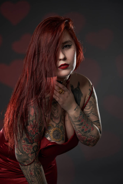 Redhead plus size woman with tattoos in lingerie, studio shot - Foto, Imagem