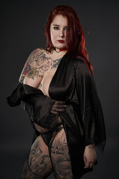 Redhead plus size woman with tattoos in lingerie, studio shot - Zdjęcie, obraz