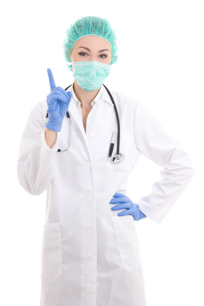 νεαρή γυναίκα γιατρός στην χειρουργός μάσκα, καπάκι και λαστιχένια γάντια μόνωσ - Φωτογραφία, εικόνα
