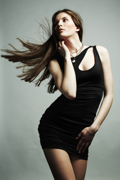 Portrait of young dancing girl with flying dark hair - Fotografie, Obrázek