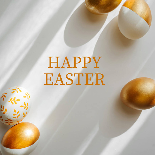 Happy Easter card. Easter golden eggs on on white background. Holiday concept.   - Foto, imagen