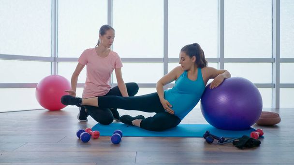 Personal Fitness Trainer Helps you with Exercise for Pregnant Women. - Fotografie, Obrázek