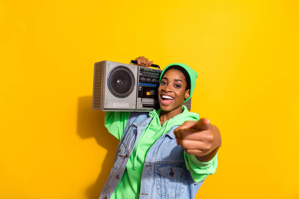 Portrait of funny person carry retro boombox point finger camera you isolated on yellow color background - Fotografie, Obrázek