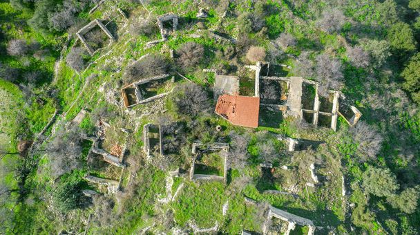 Ruins of traditional stone houses, rural depopulation in Cyprus. Aerial view directly above - Photo, Image