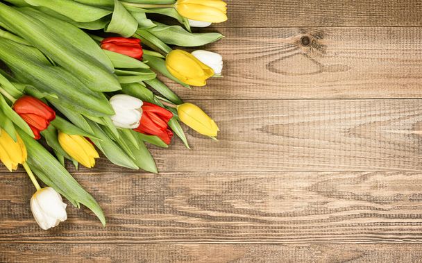 bouquet of tulips on wooden background - Fotoğraf, Görsel