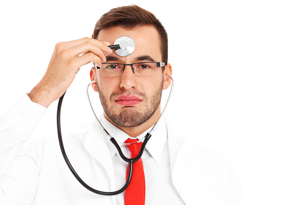 Tired doctor with stethoscope - Foto, Imagen