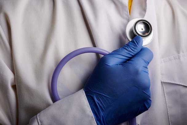 Doctor Holds Stethoscope in Hand - Photo, image