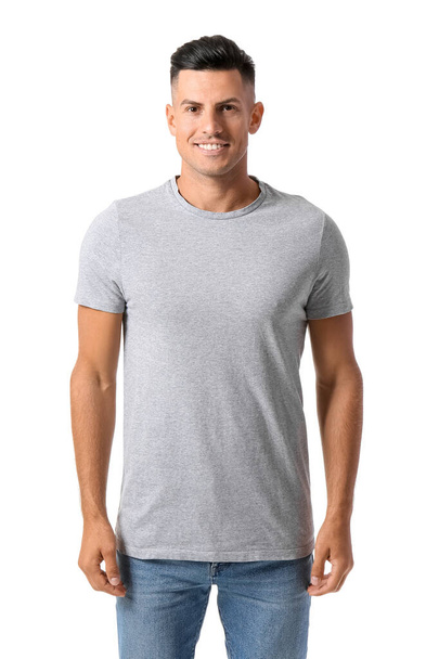 Handsome young man in stylish t-shirt isolated on white - Foto, Bild