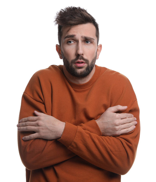 Man suffering from fever on white background. Cold symptoms - Photo, image