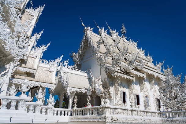 Chiang Rai, Thailand - January, 09, 2022 :Famous Thailand temple or grand white church Call Rong Khun Temple,at Chiang Rai province, northern Thailand. - Foto, afbeelding