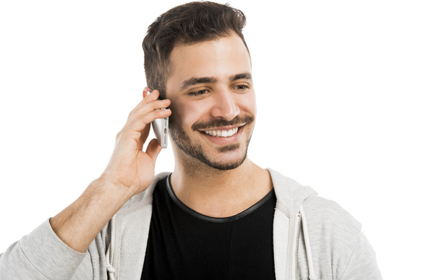 Young man talking on cell phone - Zdjęcie, obraz