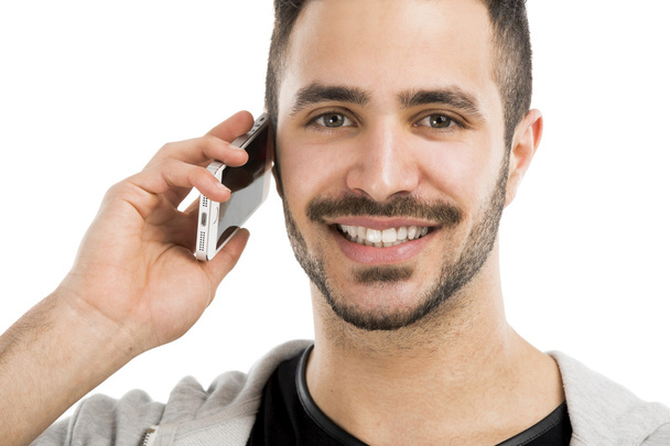 Young man talking on cell phone - Fotografie, Obrázek