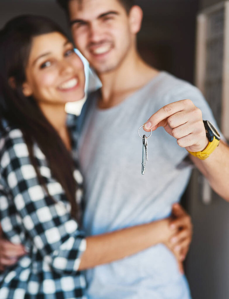 All our dreams are coming true. Portrait of a happy young couple standing in the door of their new home. - Foto, imagen