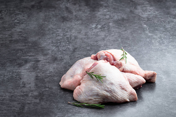 Raw chicken  thighs on gray stone background  - Foto, immagini