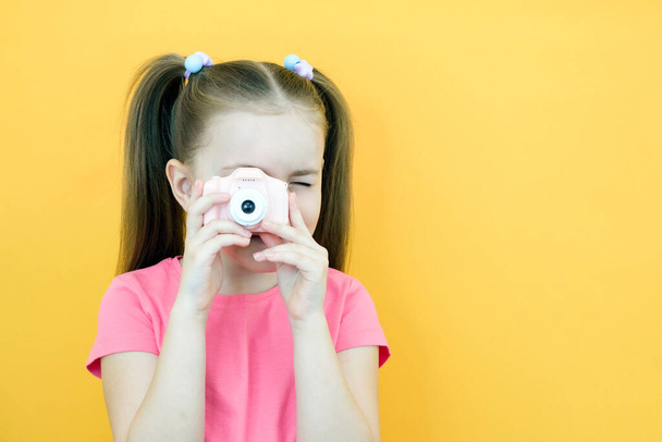 real happiness. hobby or career. beginner photographer with a camera. childhood. girl takes a picture. kid uses digital camera. happy baby photography. photography school - Zdjęcie, obraz