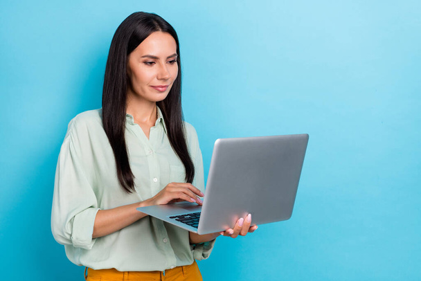 Profile side photo of young lady use laptop type project manager economist isolated over blue color background - Valokuva, kuva